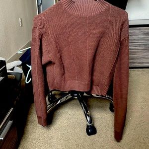 This is is a cropped Knitted sweatshirt, that you can wear for any occasion.
